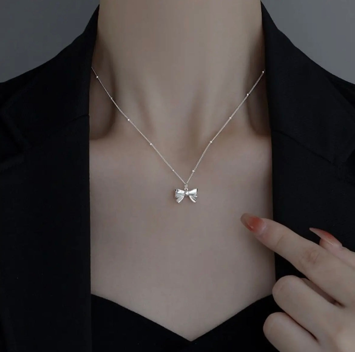 delicate silver bow necklace